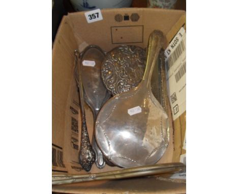 Silver-backed hand mirrors, brushes, comb and a button hook