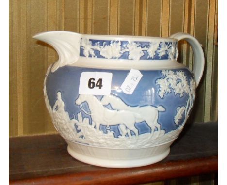 18th c. Feldspathic jug with embossed hunting scene, and two 19th c.  English porcelain teabowls with saucers