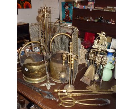 Two brass coal scuttles, several sets of fire irons, a brass firescreen, and a quantity of wine glasses