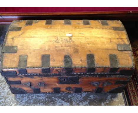 A travelling trunk with domed lid and metal mounts