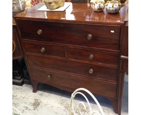 A George III mahogany secretaire desk, the secretaire drawer fitted with pigeon holes and short drawers above three further l