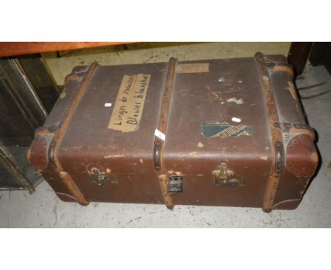 A vintage wooden bound cabin trunk