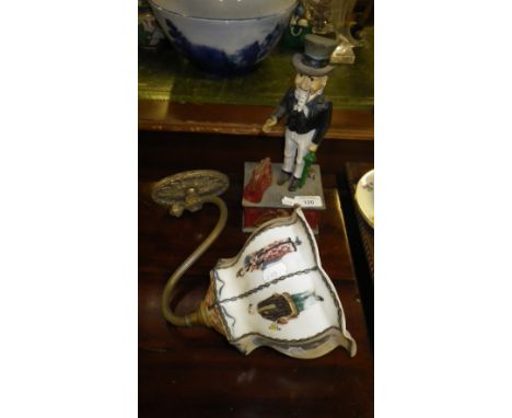 An American style cast-iron money box, featuring Uncle Sam and bracket light fitting with a glass shade