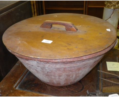 A large country pottery basin with twin handles and plywood lid