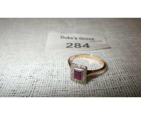 A ruby and diamond rectangular cluster ring