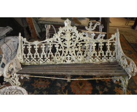 A Victorian Gothic style cast-iron garden bench (in need of repair)