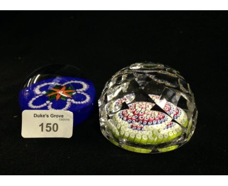 A paperweight with floral canes, with signature cane 'St K'  and another similar