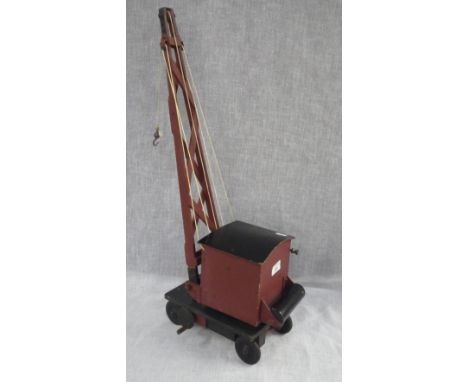 A wartime hand built toy model of a crane on wheels