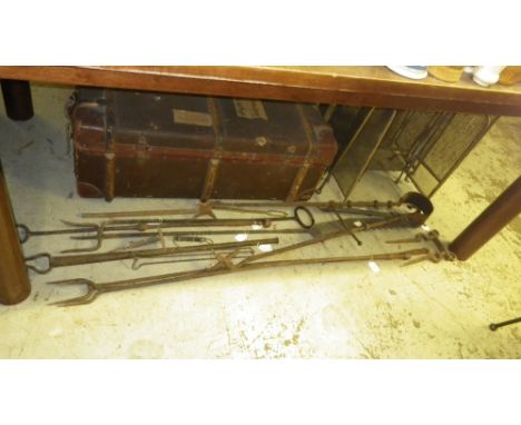 A large pair of iron fire tongs, a pot jack, a collection of vintage tools and three brass spark guards