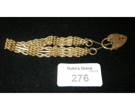 A 9ct yellow gold gate-link bracelet with heart padlock clasp