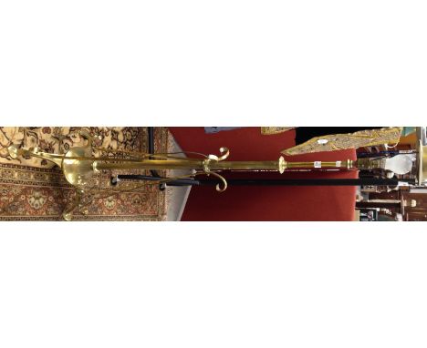 A brass adjustable standard lamp, fitted for electricity