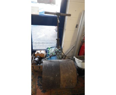An early 20th century cast-iron garden roller