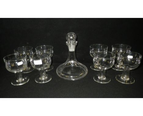 A set of eight Simon Pearce Irish footed glasses with a matching ships decanter 