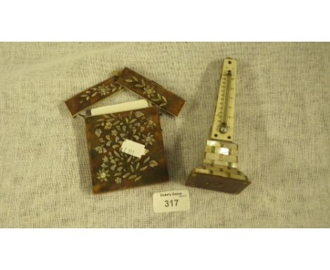 A mother of pearl obelisk shaped thermometer and similar card case