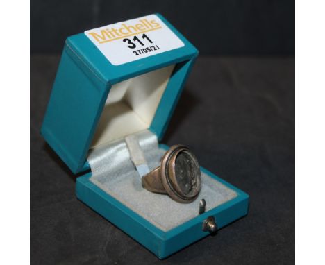 A George Jensen silver ring, model no 46A (lacking inset stone cabochon, but retaining the original George Jensen box), ring 