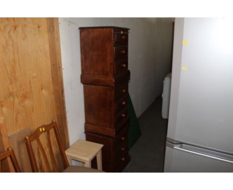 Three stained pine three drawer bedside chests, each 56 cm high, 46 cm wide, 38 cm deep, a light wood square occasional table