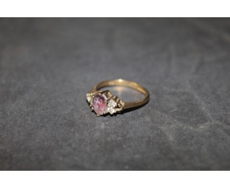 A 9ct gold white and purple stone ring, size K, (bending to shank), 2.2 grams  