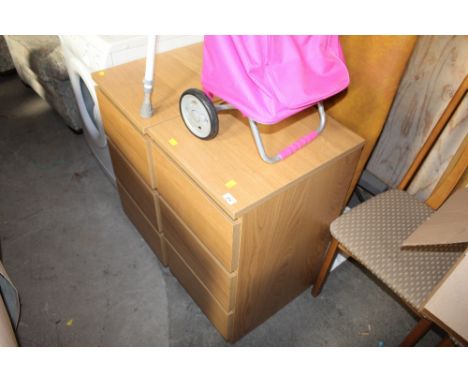 A pair of light oak effect three drawer units, each 78 cm high, 40 cm wide, 59 cm deep.