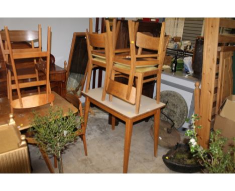 A mid century Formica topped beechwood kitchen table, 76 cm high x 92 cm long x 60 cm wide, and a set of four mid century lig