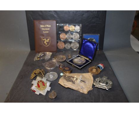 A silver Royal Army Reserves lapel badge, a selection of various cap badges, miscellaneous reward medals and coinage.