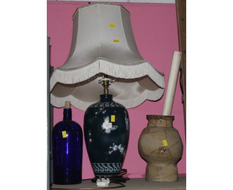 An oriental design table lamp with tasselled shade, a blue glass bottle, a stoneware vase 