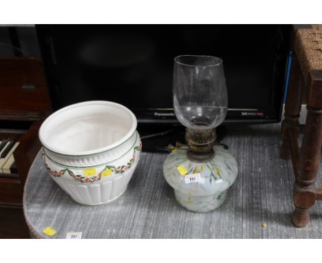 A late Victorian mottled coloured glass table oil lamp and shade, 35 cm high and a Portuguese pottery jardiniere. 