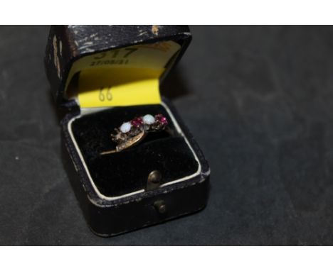 An American 10ct gold garnet and opal cross over style ring, one garnet missing, ring size M/N