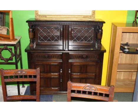 A dark elm dresser, of Ercol style. 125 cm high.