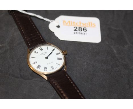 A gentleman's Rotary 9 ct gold cased wristwatch, the white enamel dial with Roman numerals to the 21 jewel movement, containe