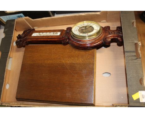 A mahogany canteen containing miscellaneous cutlery (non matching), some coinage and a Victorian mahogany barometer (AF).