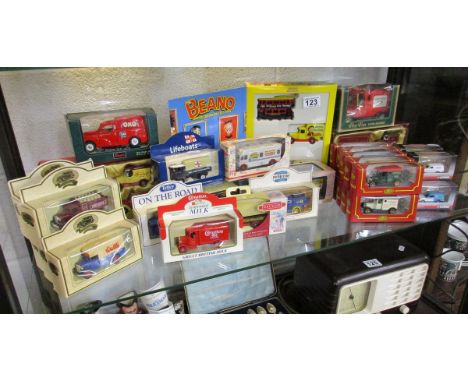 Shelf of boxed diecast cars etc