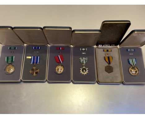 United States of America.  Six cased medals including Air Force Commendation medal named to F L Maynard, Army Commendation me