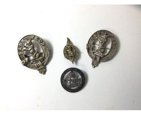 Three cast white metal moto brooches inscribed Sands Peur, a badge with G R I Sypher, inscribed For King and Empire, Services