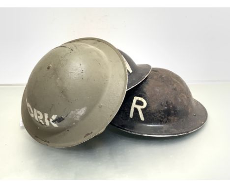 WWII British Steel helmets, two in black stencilled R &amp; W and one green YORK with original liners (3)