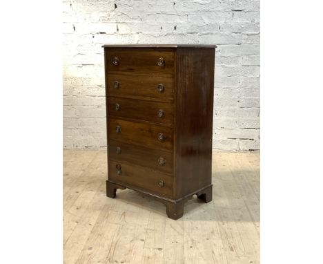 An Edwardian mahogany tall chest, the moulded top over six drawers, raised on bracket supports, H113cm, W68cm, D46cm
