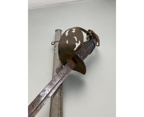 WWI German child's sword, pressed steel guard with eagle black handle, steel blade and scabbard (65cm)