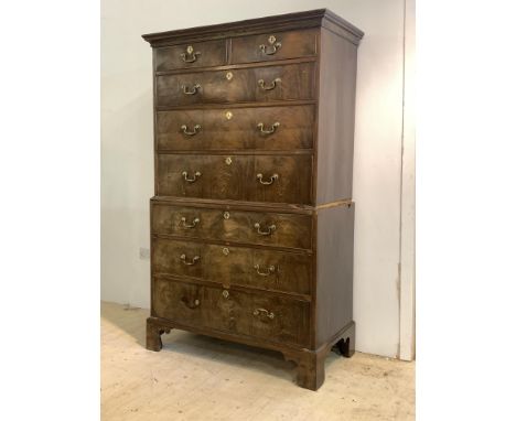 A Georgian mahogany chest on chest, the projecting cavetto cornice over two short and three long graduated drawers, the base 