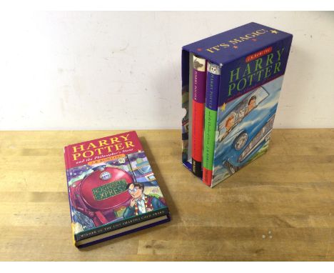 A boxed set of Harry Potter novels by J K Rowling, in hard back with dust jackets and slip case, includes Philosopher's Stone