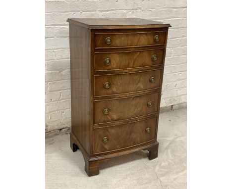 Beven Funnell Reprodux, A Georgian style mahogany bow front chest, fitted with five graduated drawers, raised on bracket supp