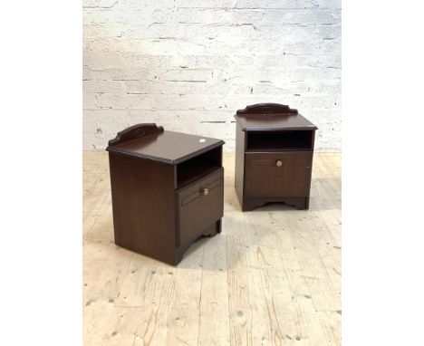 A Pair of mahogany bedside cabinets, each with ledge back over open shelf and cupboard, raised on bracket supports, H58cm, 45