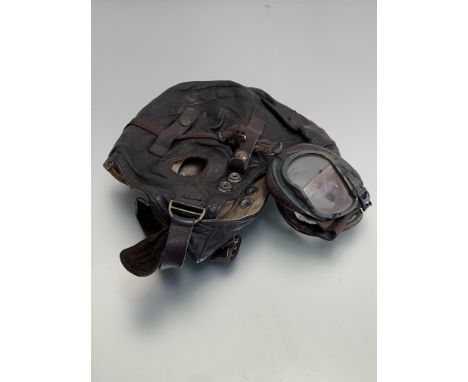 RAF leather flying helmet marked with Air Ministry mark with goggles attached