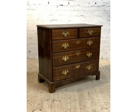 A Handsome George III oak chest, late 18th century, the moulded top over two short and three long graduated drawers, oak line