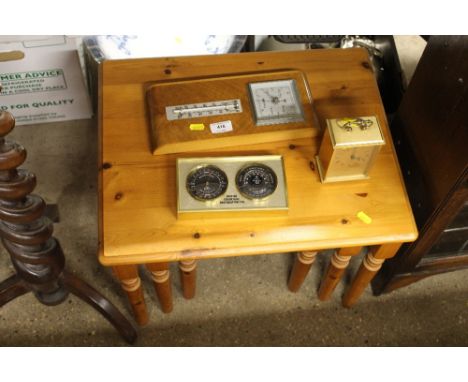 A brass cased mantel clock and two barometers 