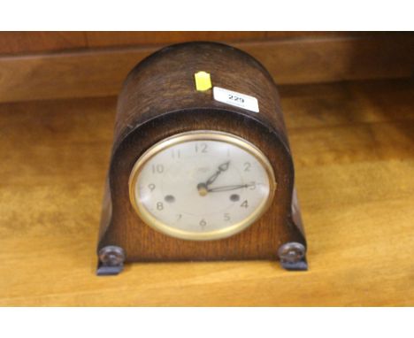 A Smiths oak cased two hole mantel clock 