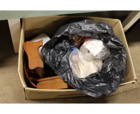 A box containing wool; a wooden book rack; cigar box and sewing related items and textiles 