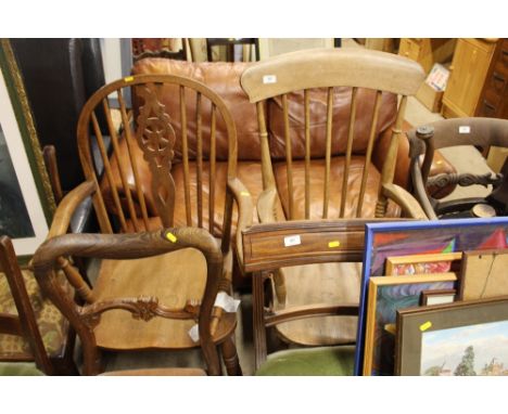 An elm seated stick back elbow chair; together with an oak stick and wheel back elbow chair AF