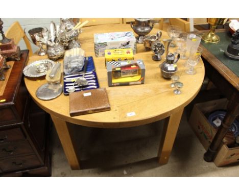 A John Lewis light oak extending dining table with a set of four chairs 