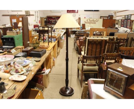A mahogany standard lamp and shade; and a stool 
