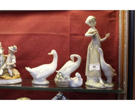 A Lladro figurine in the form of a maid and a goose; together with two other Lladro goose ornaments; and a Nao goose