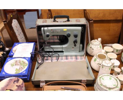 A Viking Husqvarna sewing machine in carrying case, sold as collector's item 